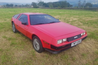 A la venta este extraño DeLorean DMC-12 pintado de rojo venta delorean dmc-12 pintado rojo